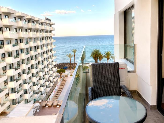 Private terrace with sea views, outdoor seating and beachfront location for relaxing stays.