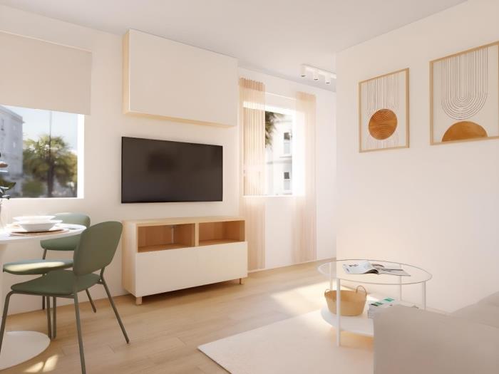 Salón moderno y luminoso con Smart TV, luz natural y diseño contemporáneo elegante.